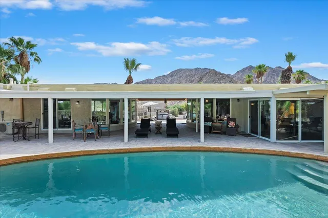 a outdoor dining space with furniture and outdoor view
