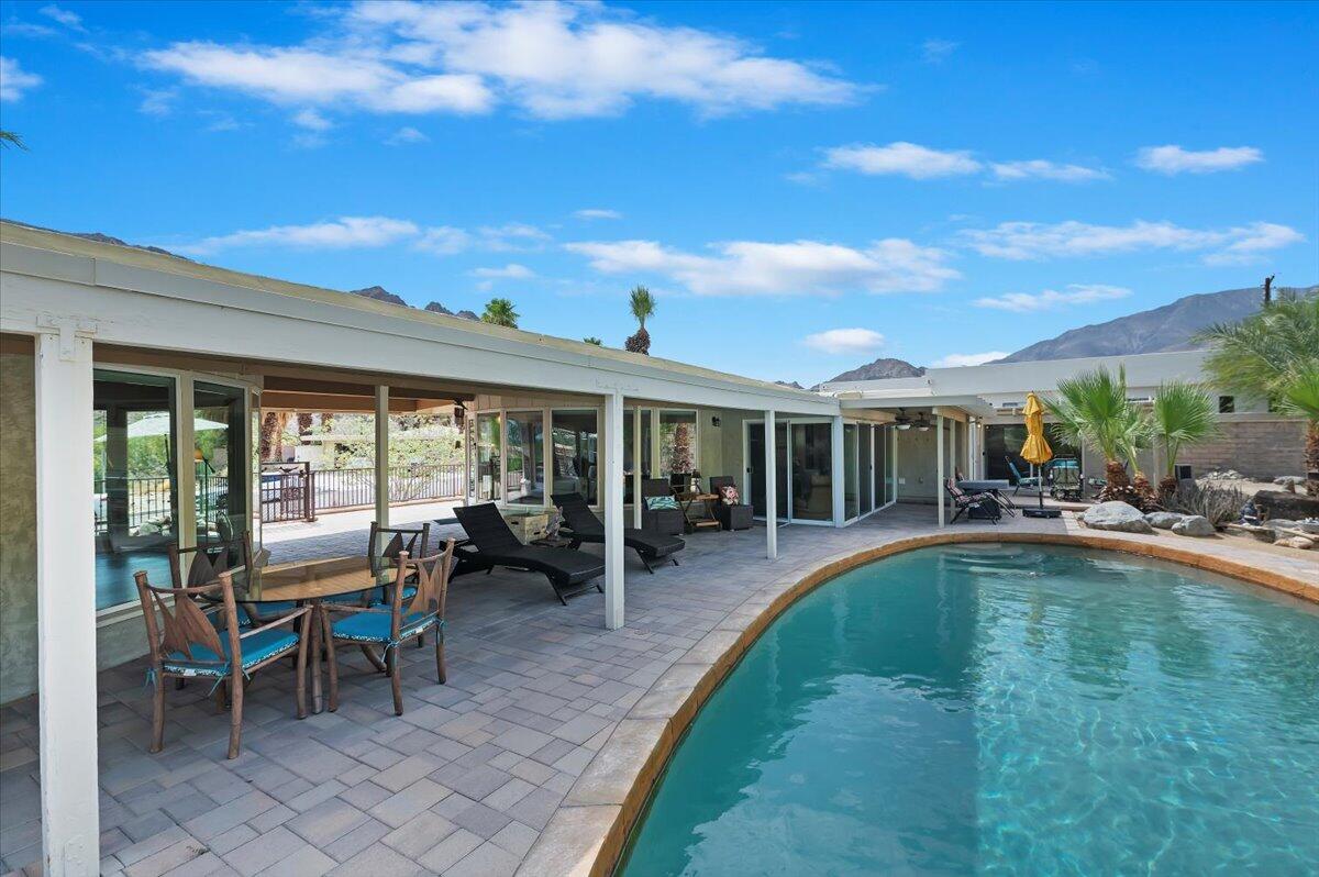 54925 Avenida Ramirez La Quinta, CA 92253 - Photo 45 of 50 a view of a house with swimming pool and sitting area