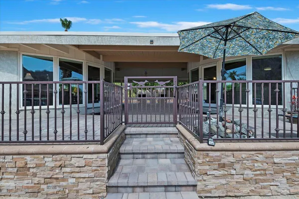 a view of a house with entrance gate