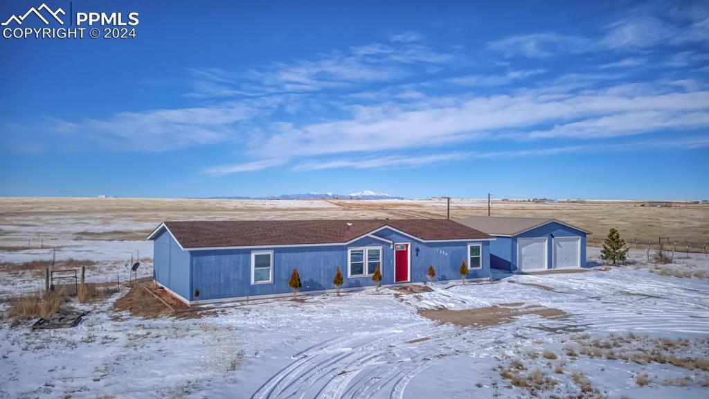7270 South Yoder Road Yoder, CO 80864 - Photo 2 of 37 a view of a house with a yard