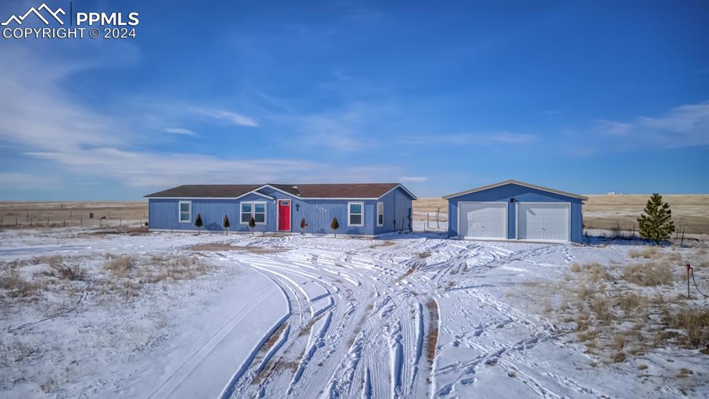 7270 South Yoder Road Yoder, CO 80864 - Photo 30 of 37 a spacious bathroom with a sink and a vanity