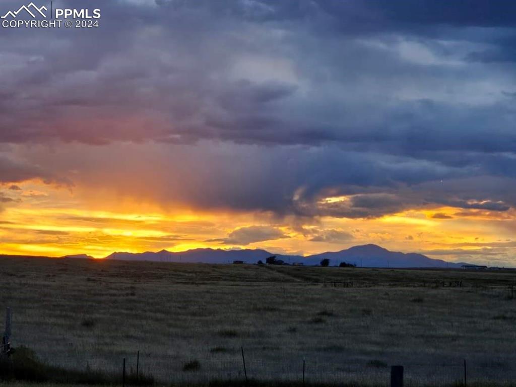 7270 South Yoder Road Yoder, CO 80864 - Photo 36 of 37 a view of an ocean and a mountain