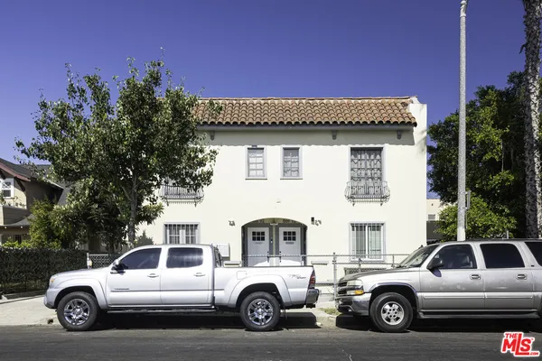 a view of a car parked in front of a house