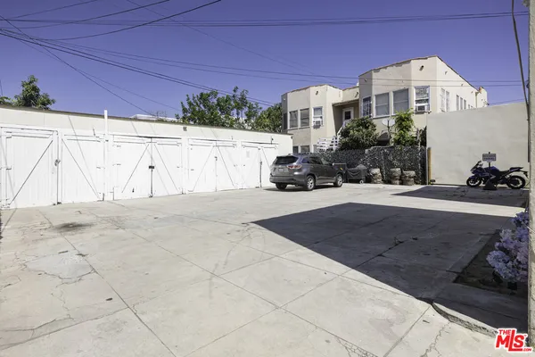 a view of a car parked in front of a house