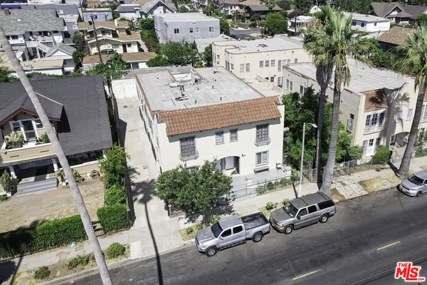 an aerial view of a house with a patio