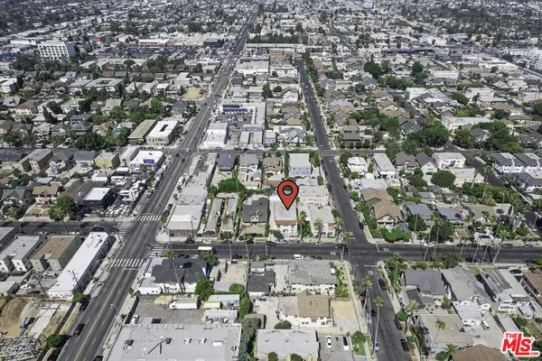 an aerial view of residential building and parking space