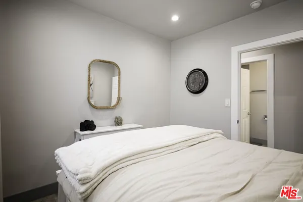 a bathroom with a sink a mirror and a toilet