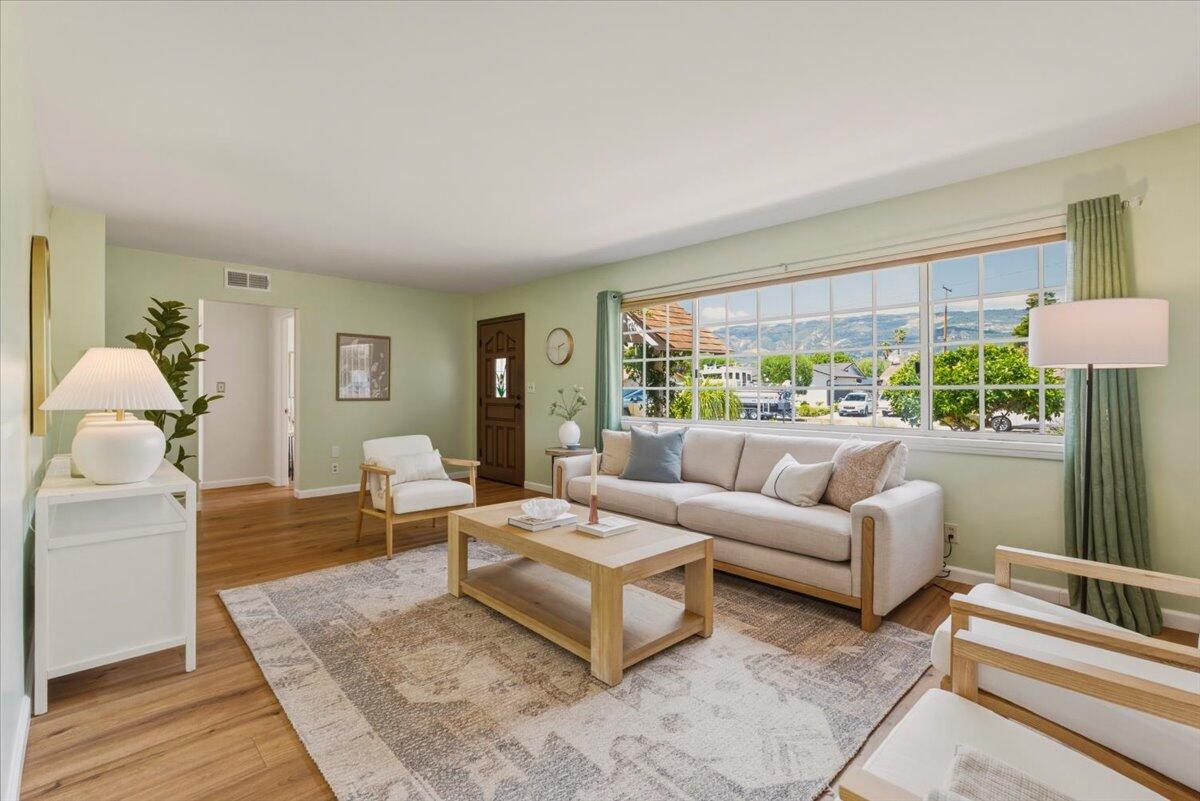 6231 Aberdeen Avenue Goleta, CA 93117 - Photo 1 of 15 a living room with furniture and a large window