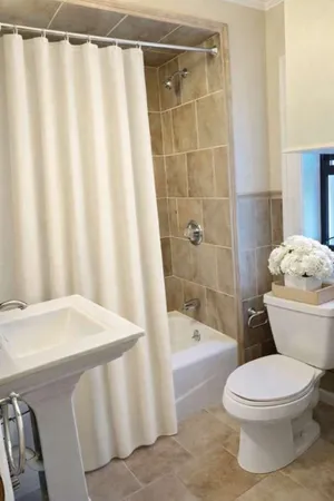 a bathroom with a bathtub and shower