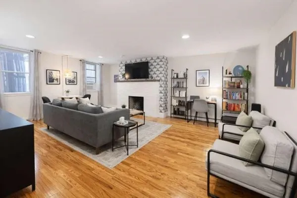 a living room with furniture or couch and a fireplace