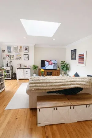 a living room with granite countertop furniture and painting on the wall