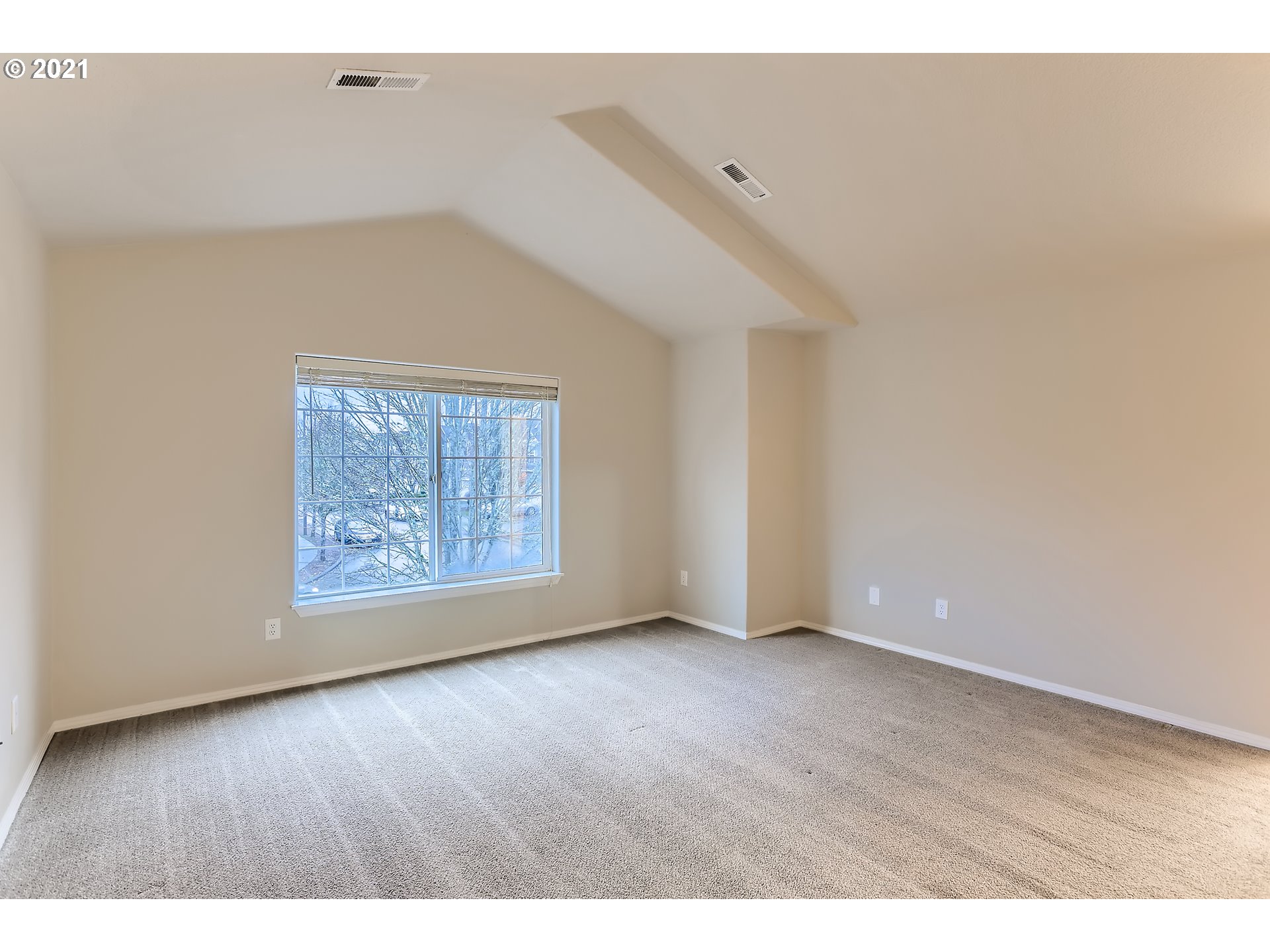 17670 Southwest September Lane Beaverton, OR 97003 - Photo 17 of 31 a view of an empty room with wooden floor and a window