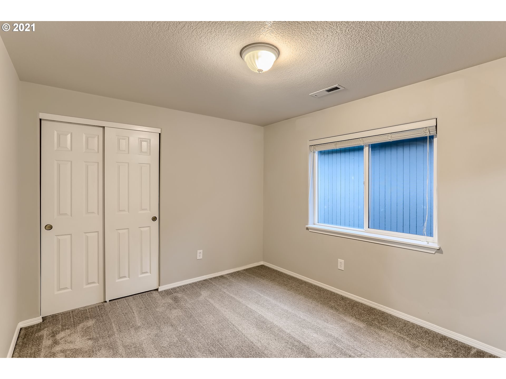 17670 Southwest September Lane Beaverton, OR 97003 - Photo 21 of 31 a view of an empty room with wooden floor