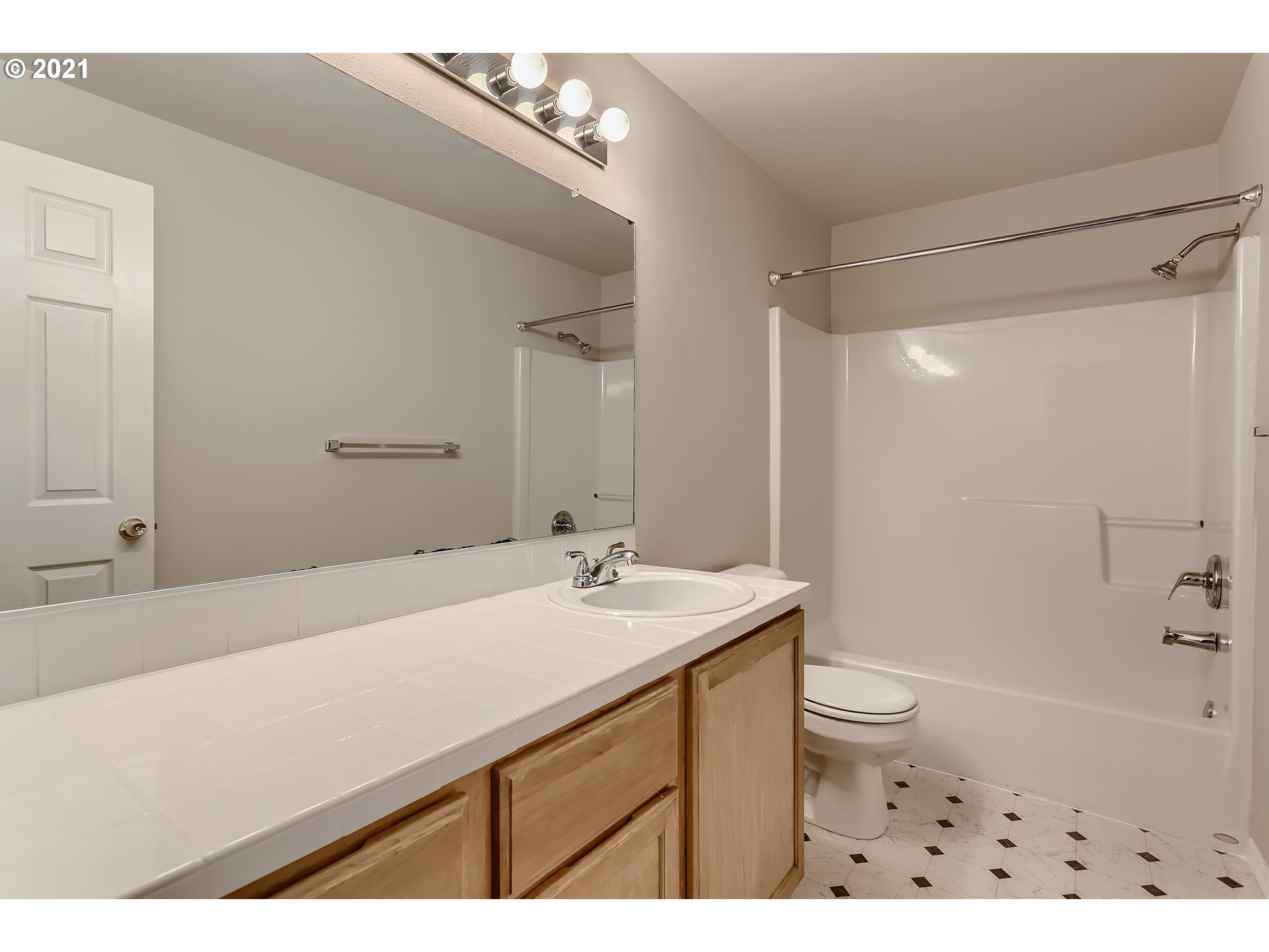 17670 Southwest September Lane Beaverton, OR 97003 - Photo 27 of 31 a bathroom with a sink a toilet and shower