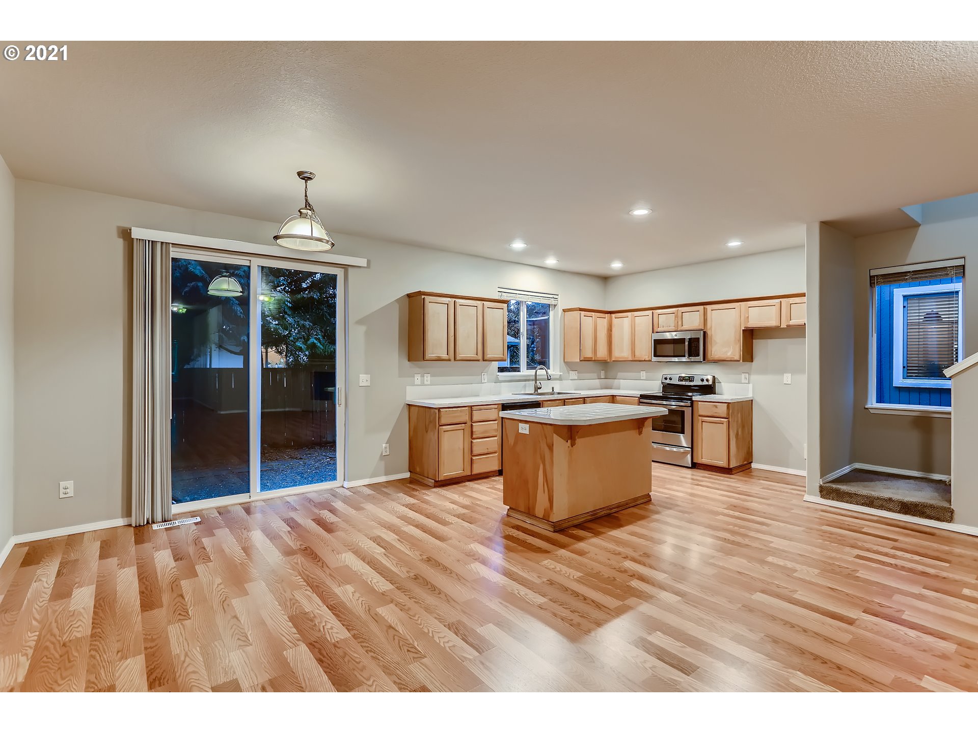 17670 Southwest September Lane Beaverton, OR 97003 - Photo 10 of 31 a large kitchen with lots of counter top space and stainless steel appliances