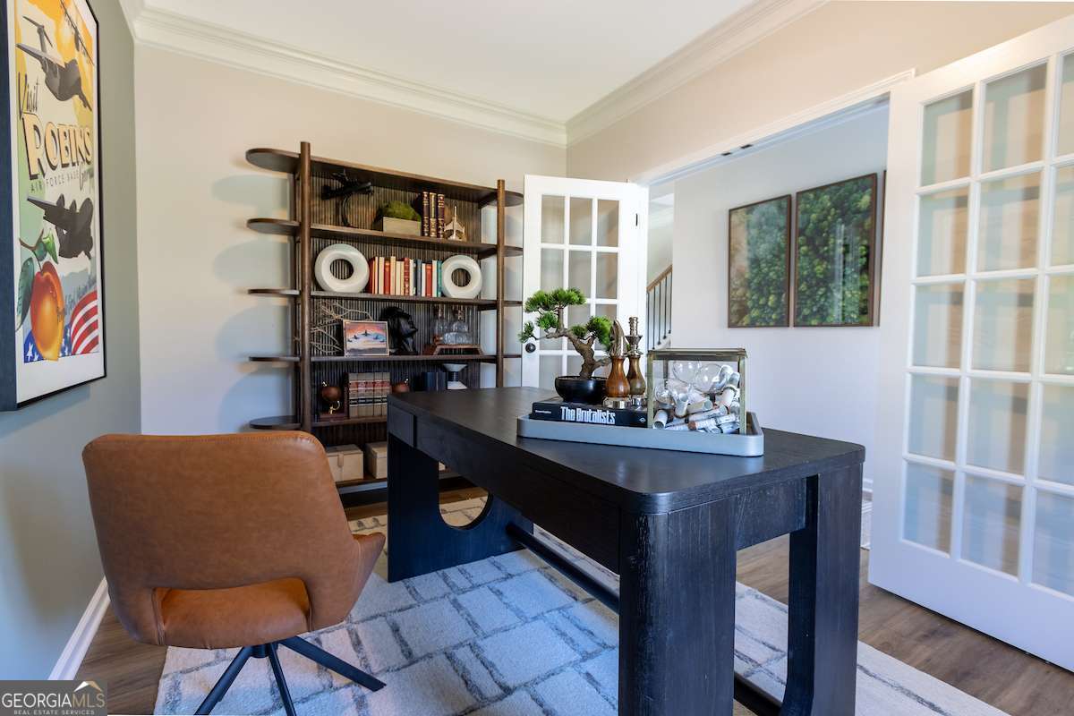 1422 Trellis Court, Unit (LOT 22) Hampton, GA 30228 - Photo 26 of 34 a dining room with furniture and window