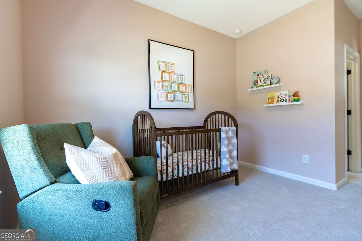 1422 Trellis Court, Unit (LOT 22) Hampton, GA 30228 - Photo 4 of 34 a view of livingroom with furniture and windows