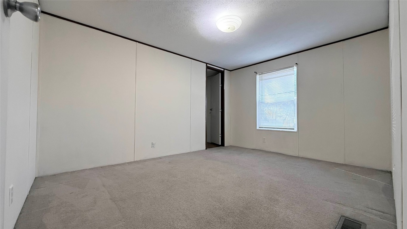 1430 West Howard Lane, Unit 4 Austin, TX 78728 - Photo 12 of 18 an empty room with windows