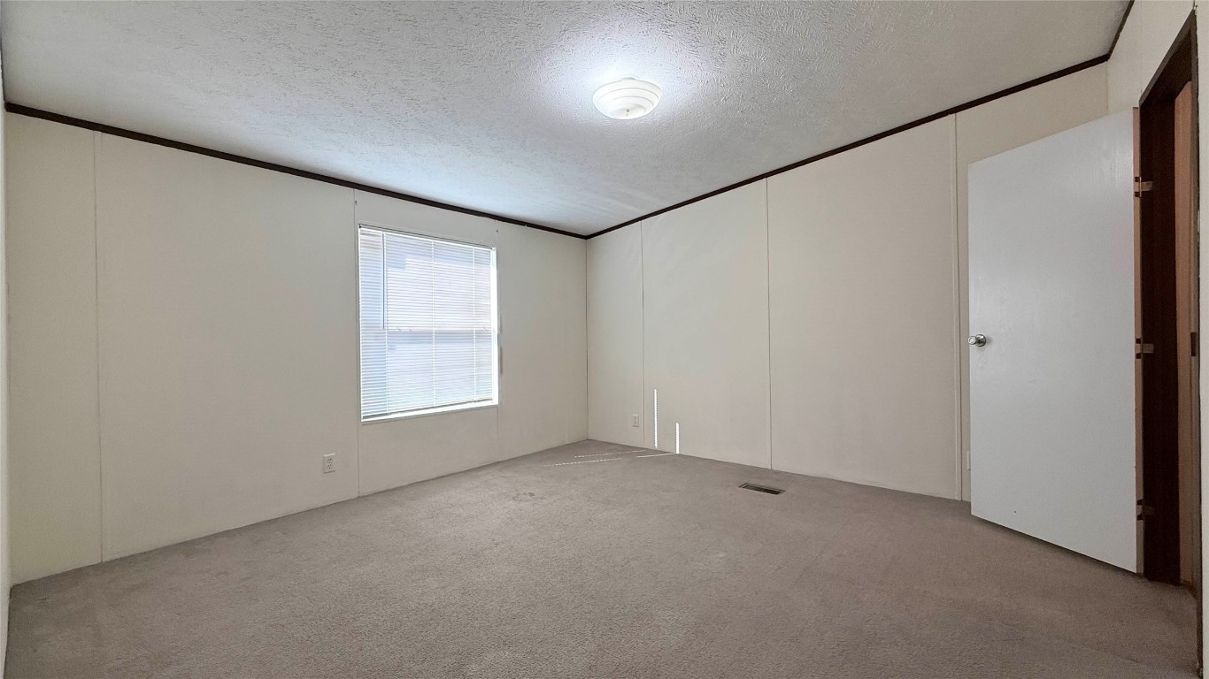 1430 West Howard Lane, Unit 4 Austin, TX 78728 - Photo 13 of 18 an empty room with a window