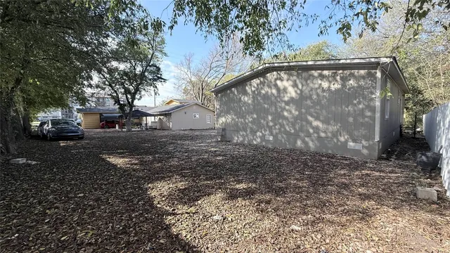 a view of a yard with large tree