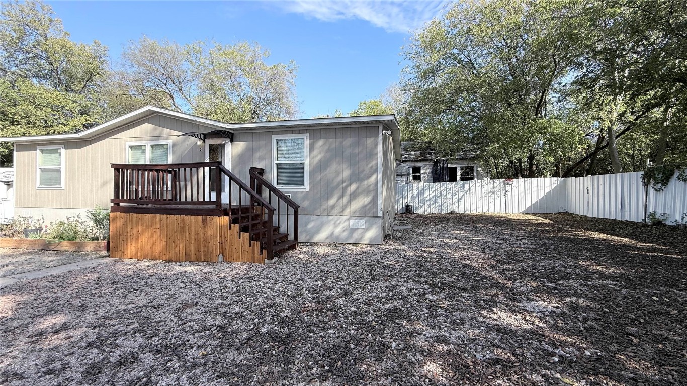 1430 West Howard Lane, Unit 4 Austin, TX 78728 - Photo 3 of 18 a view of a house with a yard and large tree