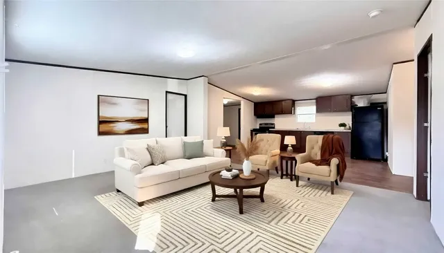 a living room with furniture and a table