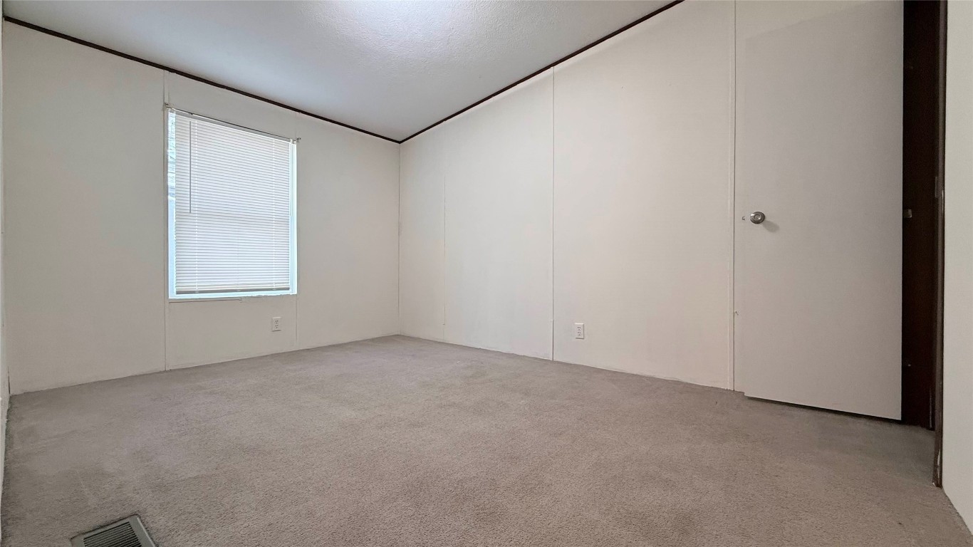1430 West Howard Lane, Unit 4 Austin, TX 78728 - Photo 10 of 18 an empty room with a window
