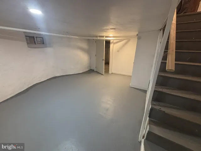 a view of an empty room with stairs