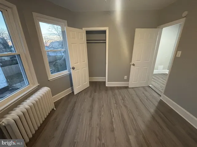 a view of entryway with wooden floor