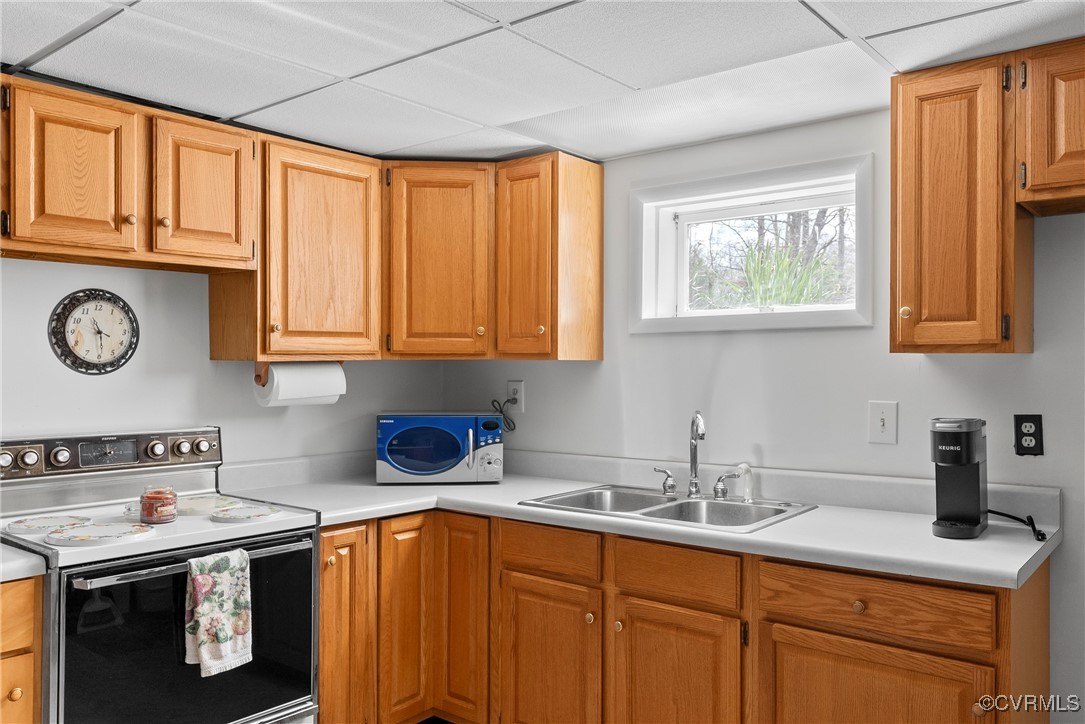9320 Old Forge Road Providence Forge, VA 23140 - Photo 36 of 50 Kitchen with light countertops, a sink, range with