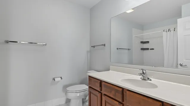a bathroom with a sink toilet and vanity