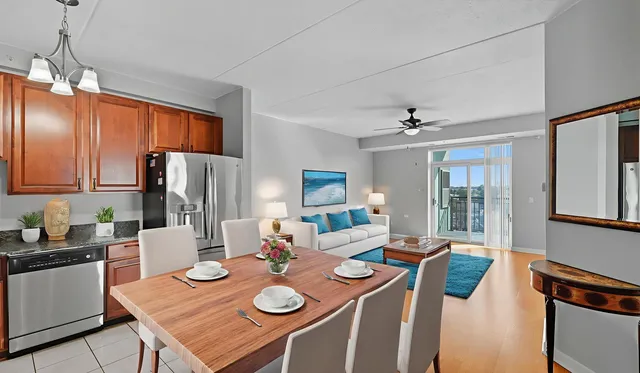 a kitchen with a dining table and chairs
