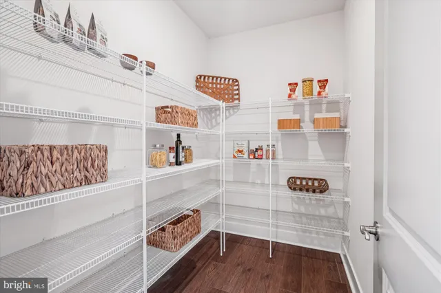 a view of kitchen with furniture and wooden floor