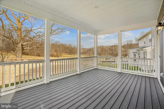 a view of a balcony with wooden floor