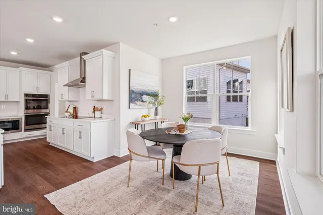a kitchen with stainless steel appliances kitchen island granite countertop a sink and cabinets