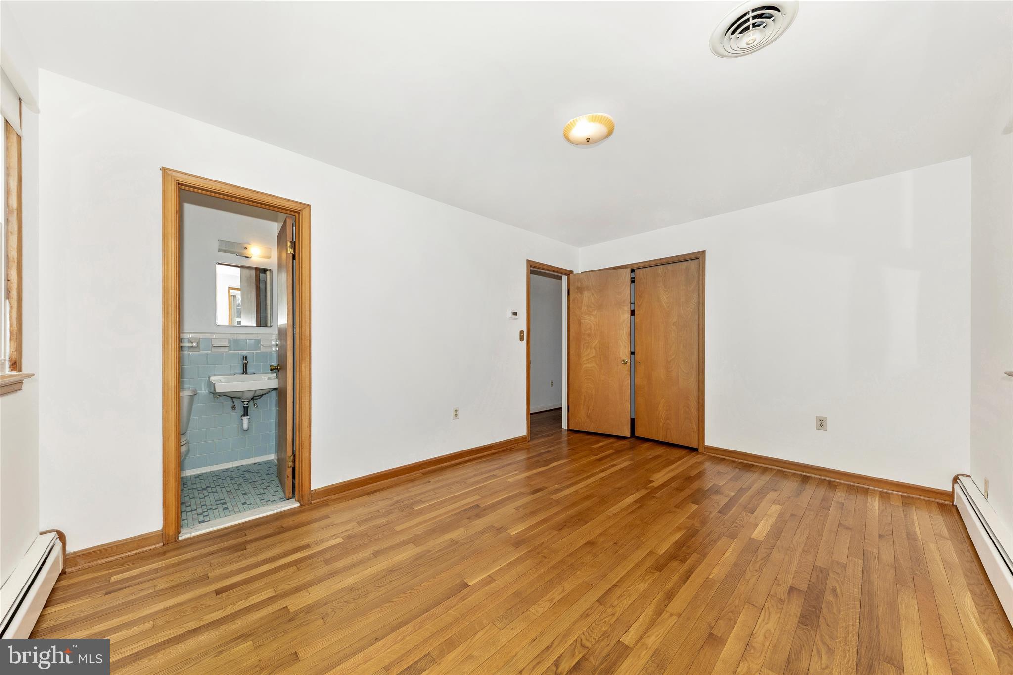 9811 Watkins Road Gaithersburg, MD 20882 - Photo 16 of 54 a view of an empty room with wooden floor