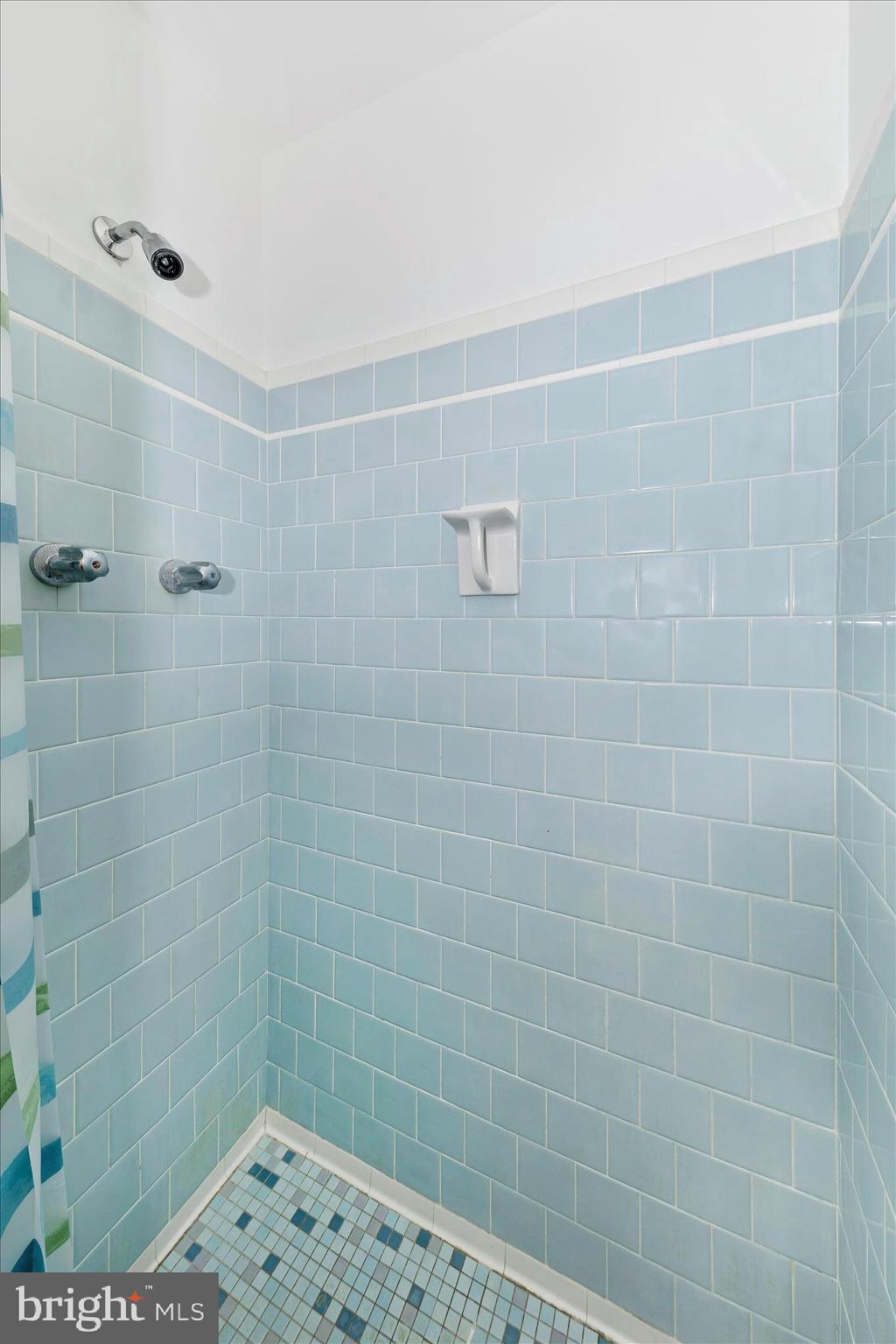 9811 Watkins Road Gaithersburg, MD 20882 - Photo 19 of 54 a bathroom with a shower