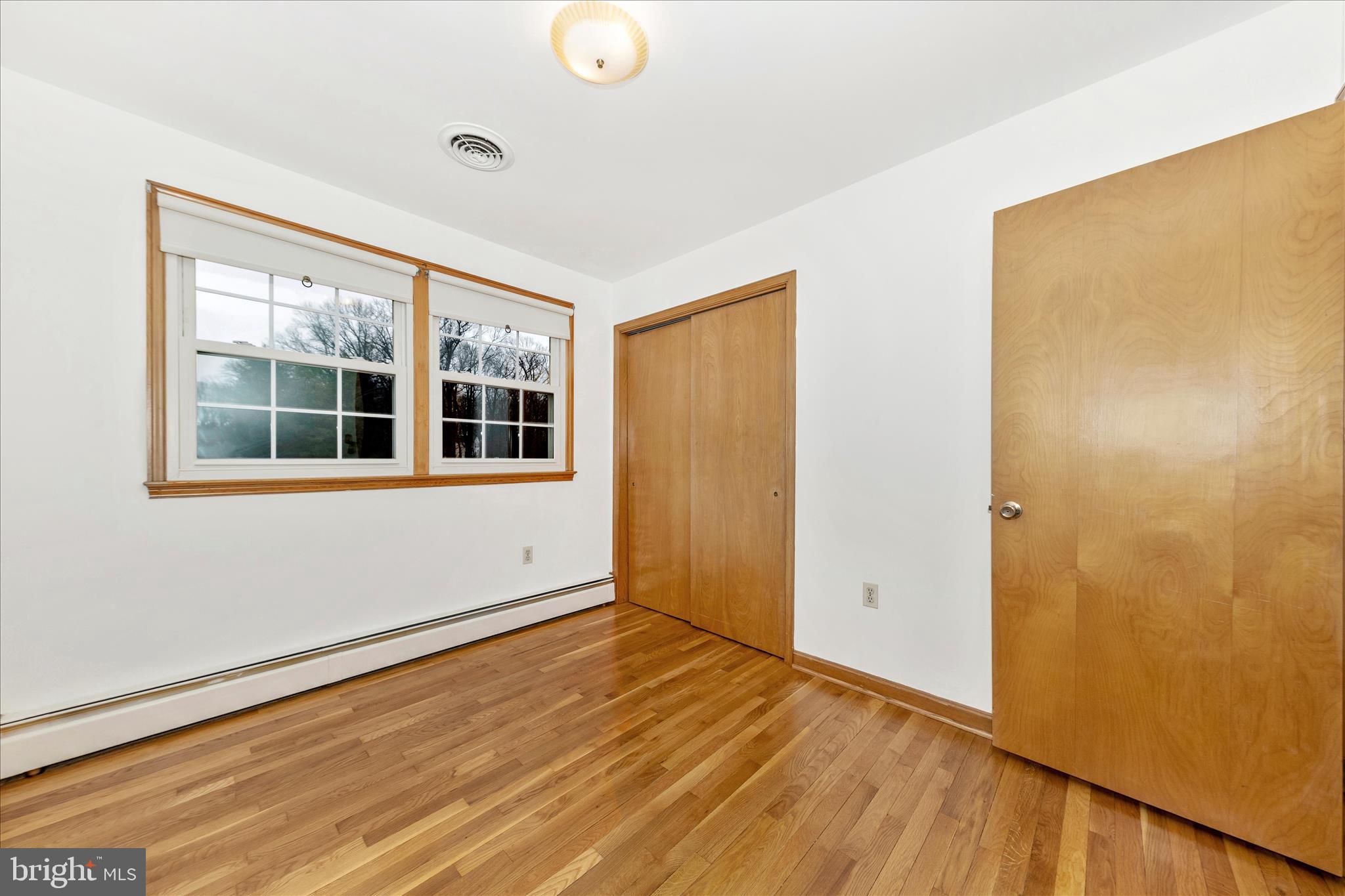 9811 Watkins Road Gaithersburg, MD 20882 - Photo 23 of 54 a view of empty room with wooden floor and fan