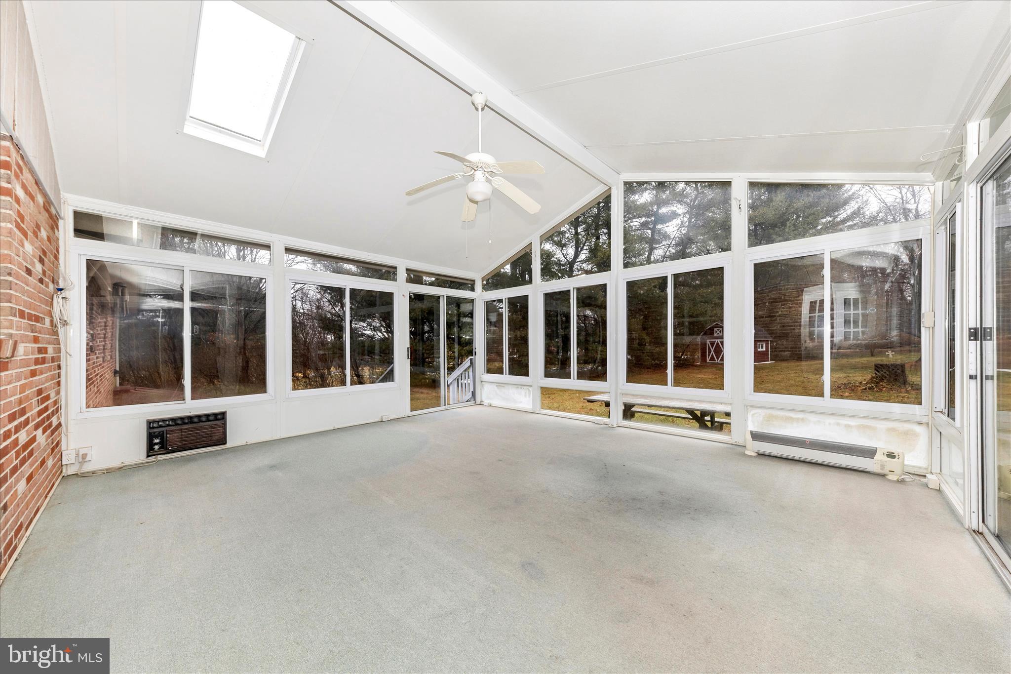 9811 Watkins Road Gaithersburg, MD 20882 - Photo 29 of 54 a view of an empty room with a large window and pool table