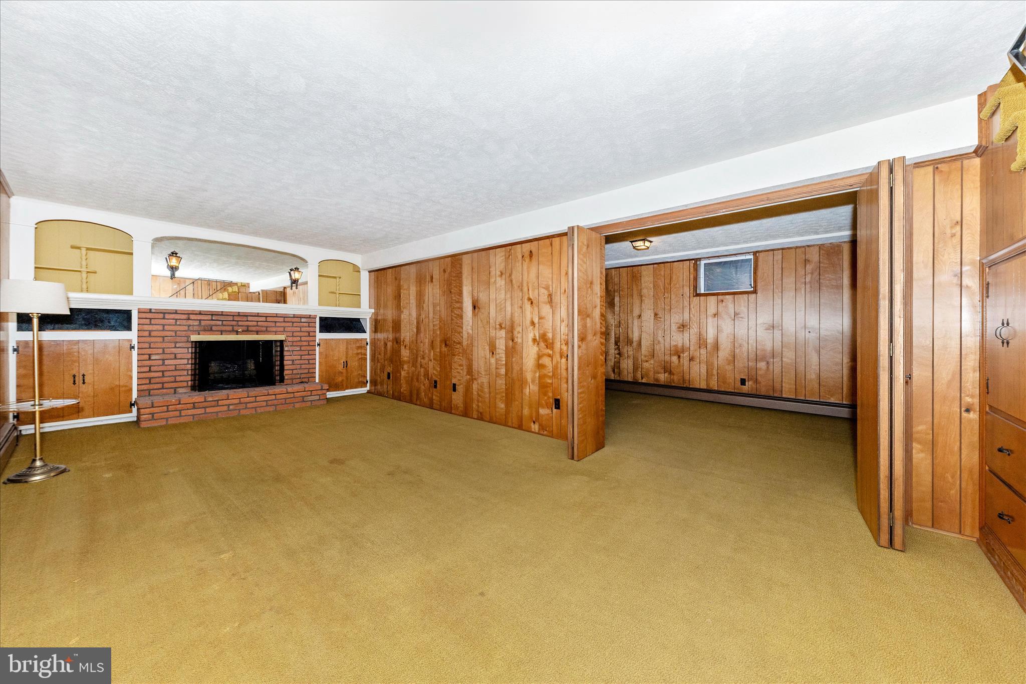 9811 Watkins Road Gaithersburg, MD 20882 - Photo 32 of 54 a view of an empty room with fire place and a fireplace