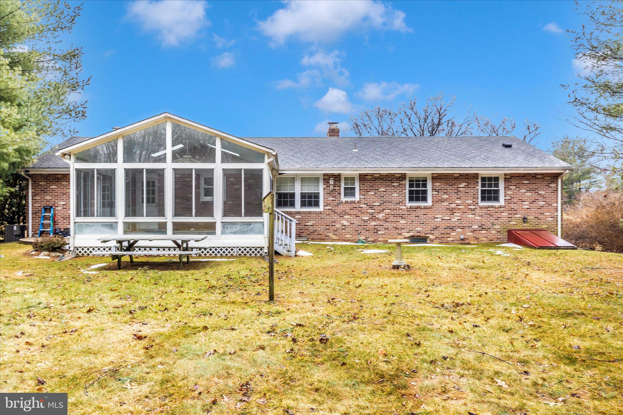 9811 Watkins Road Gaithersburg, MD 20882 - Photo 43 of 54 a view of a house with swimming pool and a yard