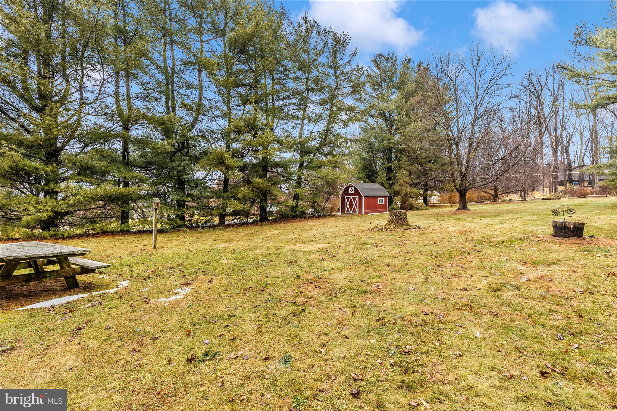 9811 Watkins Road Gaithersburg, MD 20882 - Photo 44 of 54 a view of swimming pool with lawn chairs and trees