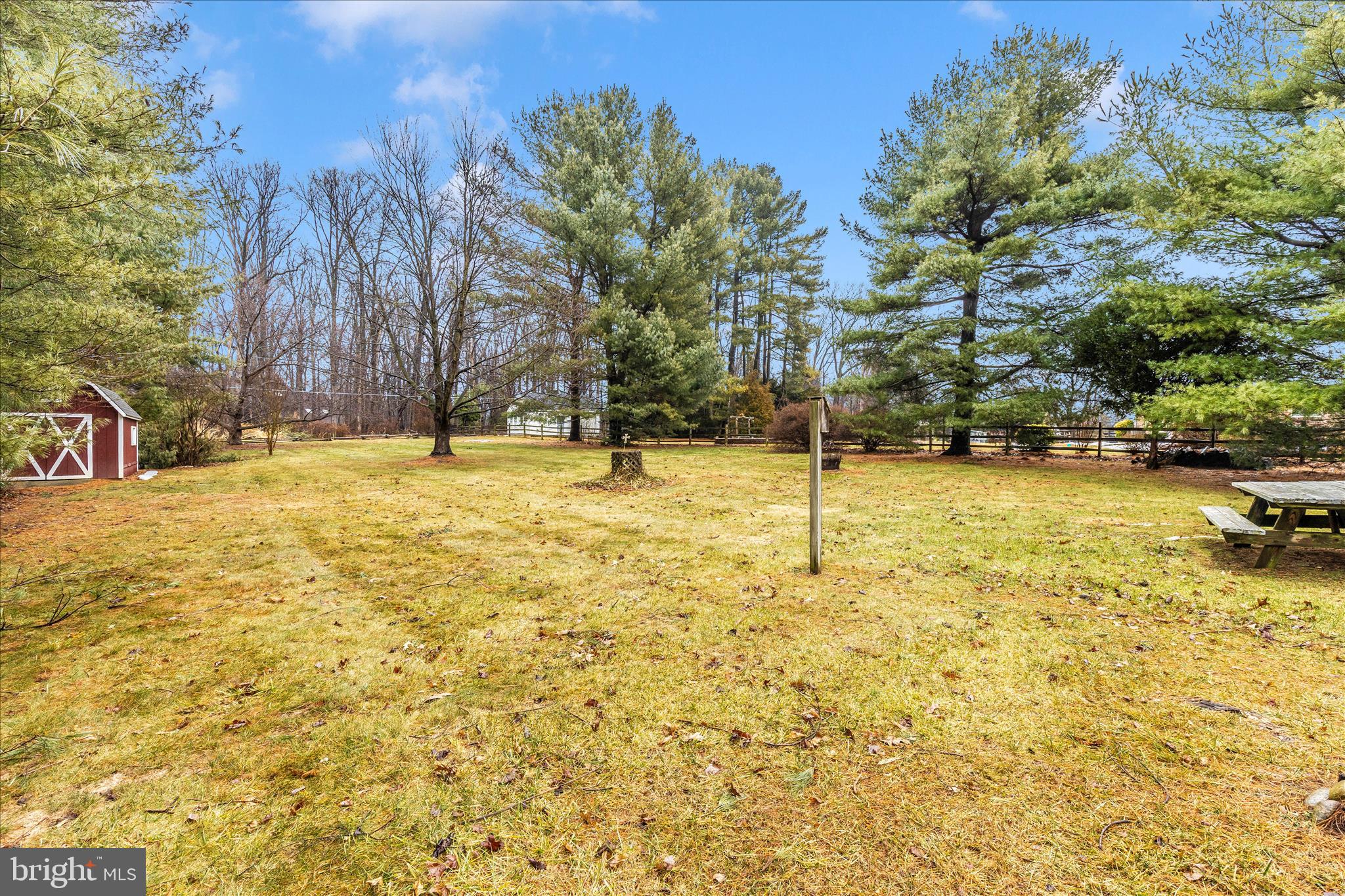 9811 Watkins Road Gaithersburg, MD 20882 - Photo 45 of 54 a swimming pool with some trees in the background