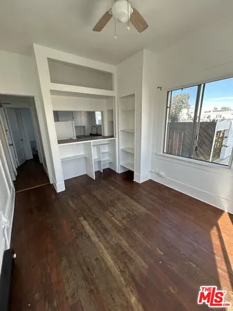 a room with a bed and a walk in closet