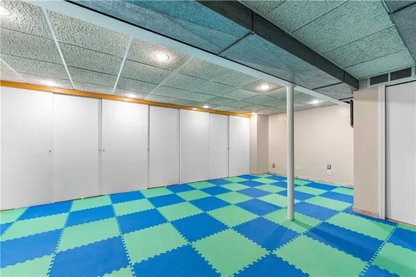 a room that has a rug and a window