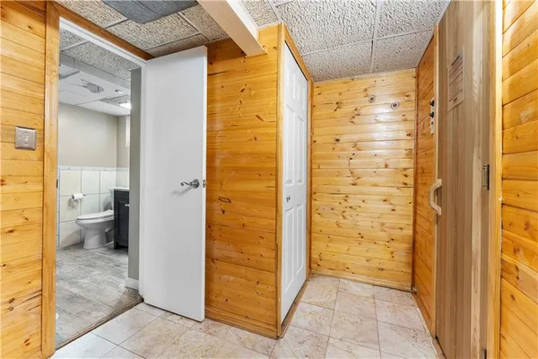 a view of a bathroom with a shower and a sink