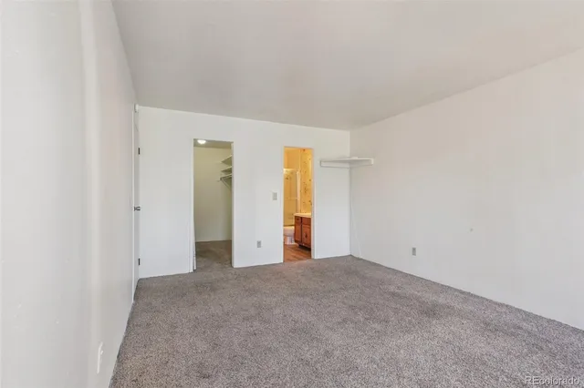 an empty room with an entryway door