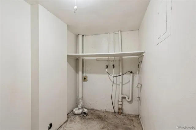 a view of a storage & utility room with racks on the wall