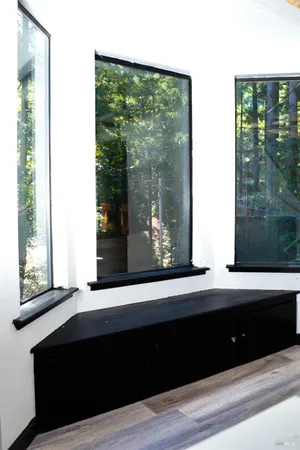 a view of a small space with wooden floor