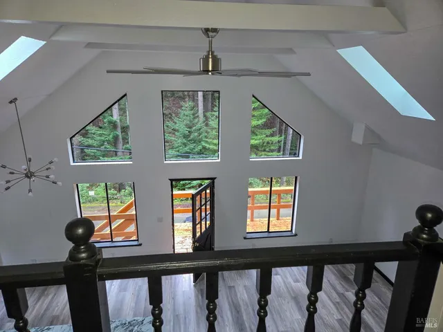 a view of a small space with wooden floor